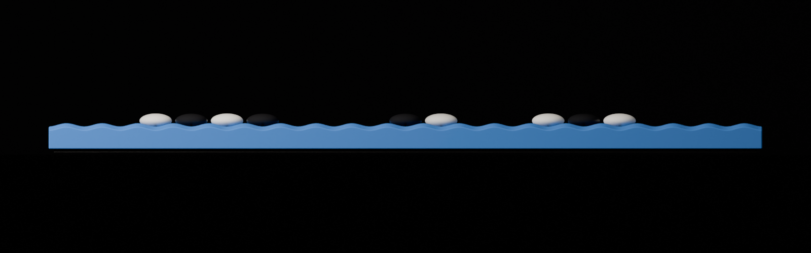 The board seen edge-on, showing how shallow the wave really is, with stones resting along the top.